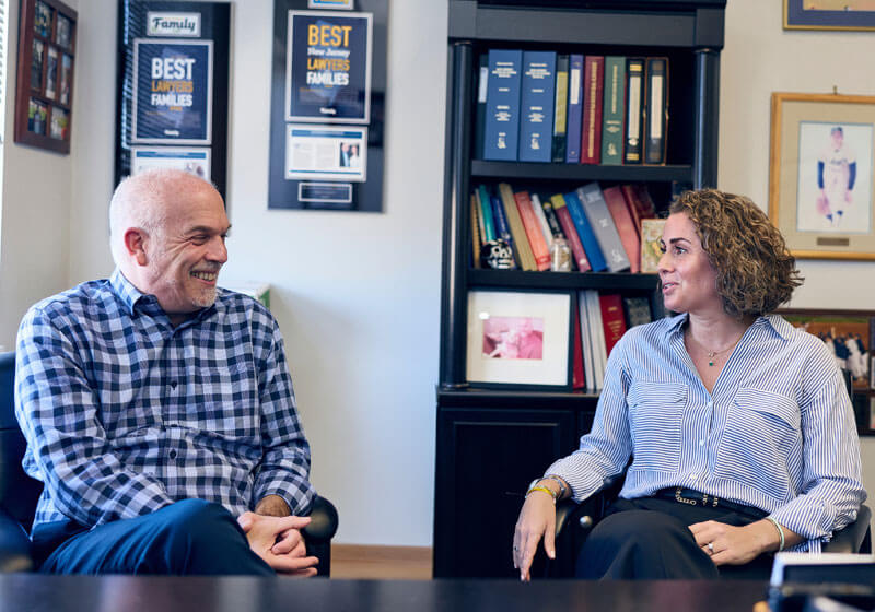 Andrew M. Wolfenson and Rebecca S. Ashkenazi talking at the office
